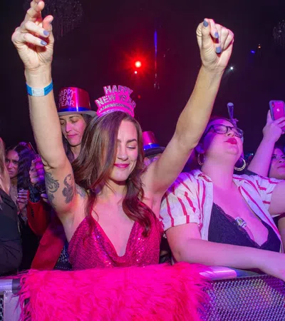 a group of people wearing party hats