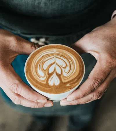 a person holding a cup