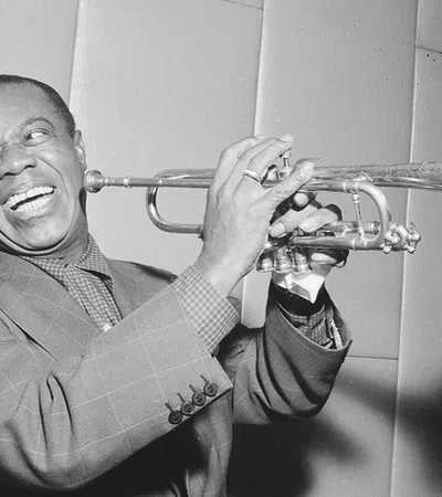 Louis Armstrong playing a trumpet