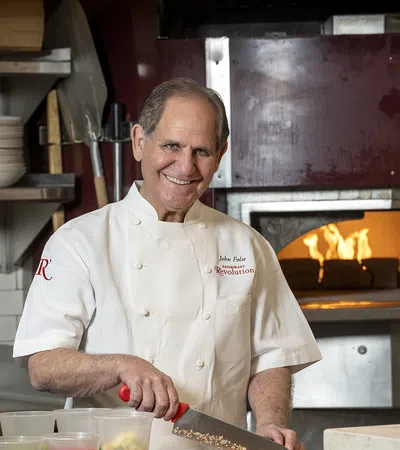 John Folse in a kitchen