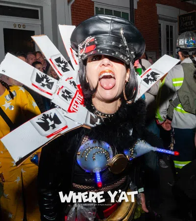 a person wearing a helmet and holding a sign