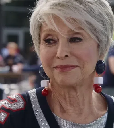 Rita Moreno with a microphone