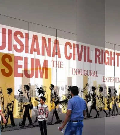 a group of people walking in front of a sign
