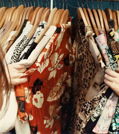 a person looking at a bunch of ties