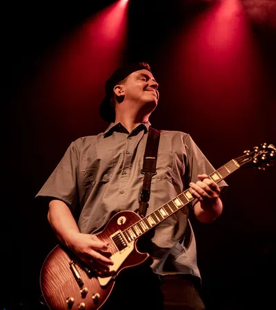 a man playing a guitar