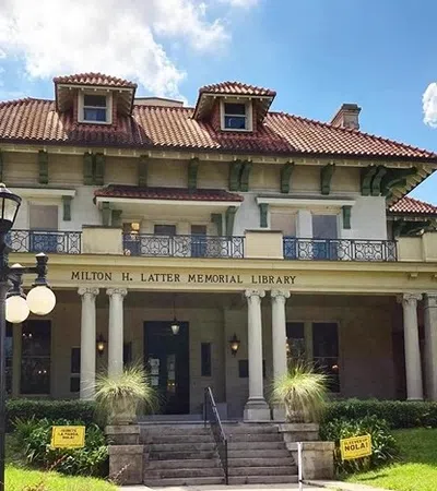a large building with columns and a staircase
