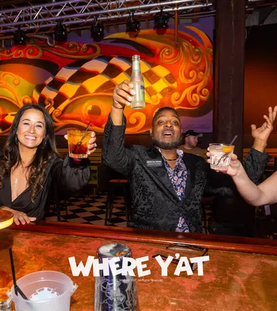 a group of people sitting at a table with drinks