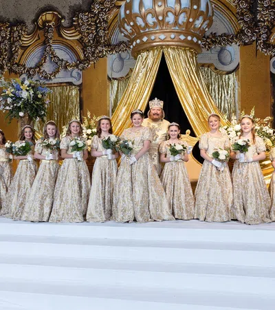 a group of women in white dresses