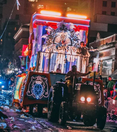 a parade with a horse carriage
