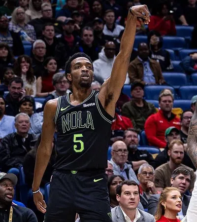 a basketball player jumping to make a basket
