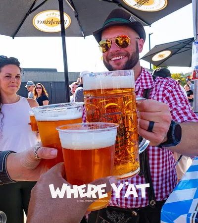 a man and woman holding glasses of beer