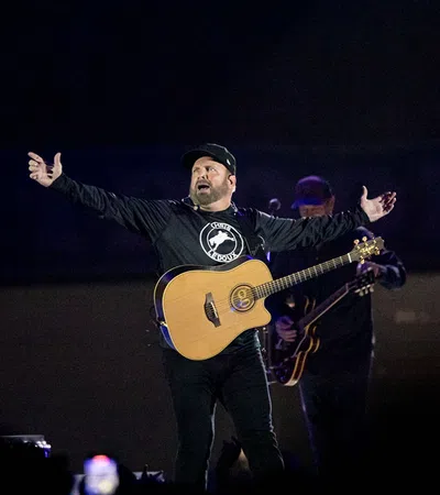 a man holding a guitar