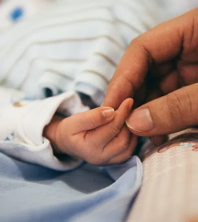 a person holding a baby