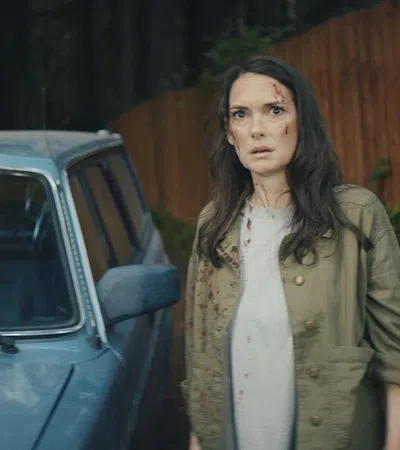 a person standing next to a car