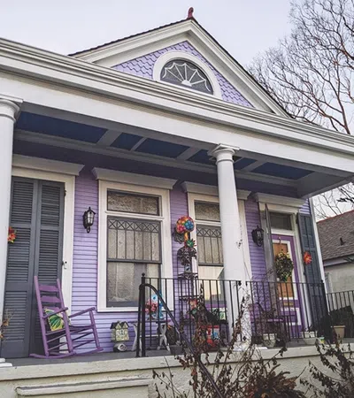 a house with a porch and a fence