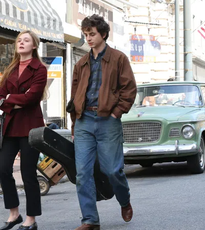 a man and woman walking down the street