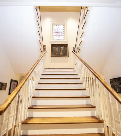 a staircase with pictures on the wall