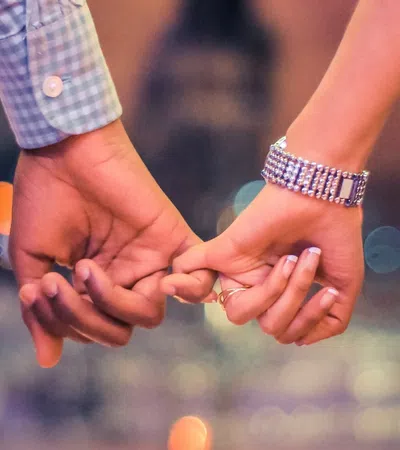 a close-up of hands shaking