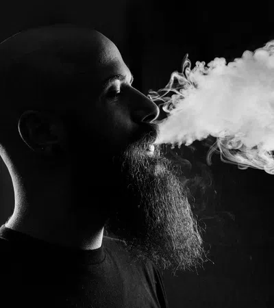 a man with a smokey face
