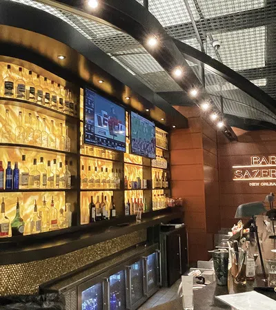 a bar with many bottles of alcohol