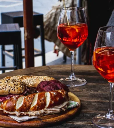 a sandwich and a glass of wine
