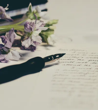 a black pen on a white surface