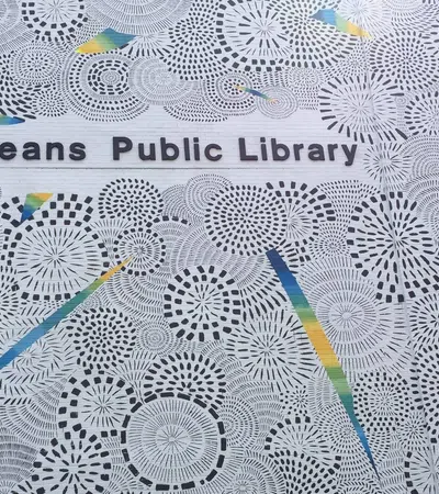 Intricate circular patterns with colorful geometric shapes surrounding New Orleans Public Library text.