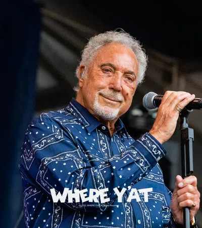 Tom Jones holding a microphone