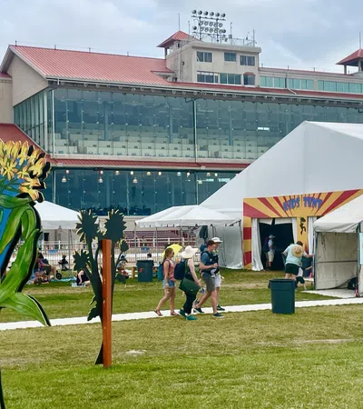 a group of people walking around a fair