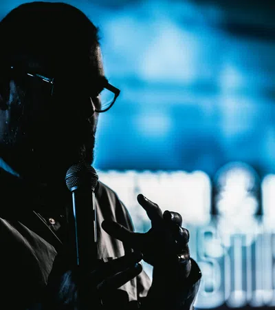 a man wearing a headset and holding a gun