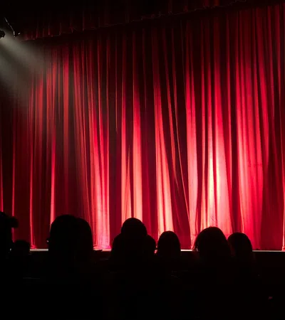 a stage with a red curtain