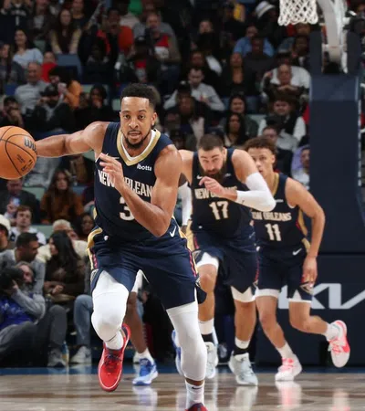 a group of men playing basketball