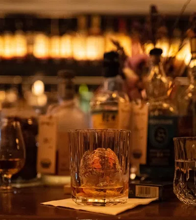 a group of glasses on a bar