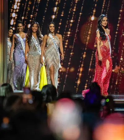 a group of women in dresses on a stage