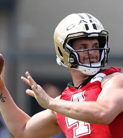 a person wearing a helmet and holding a football