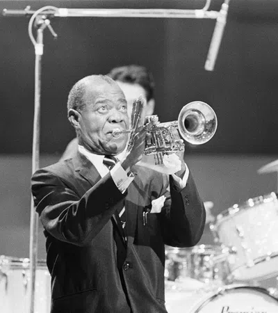 Louis Armstrong playing a trumpet