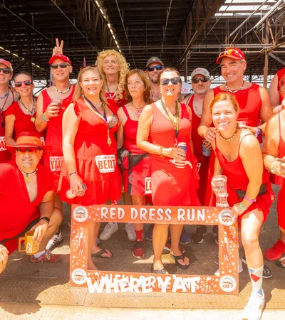 a group of people wearing red uniforms