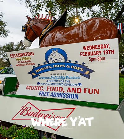 a horse statue on top of a sign