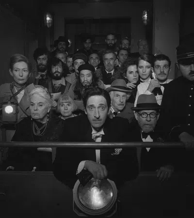 Adrien Brody et al. posing for a photo