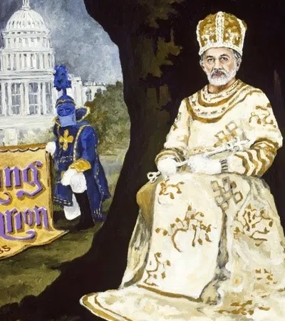 a statue of a man and a woman in front of a castle