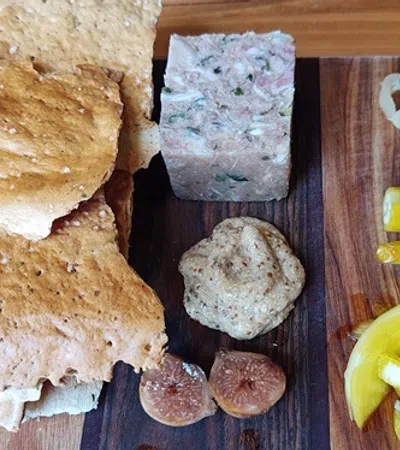 a wooden cutting board with food on it