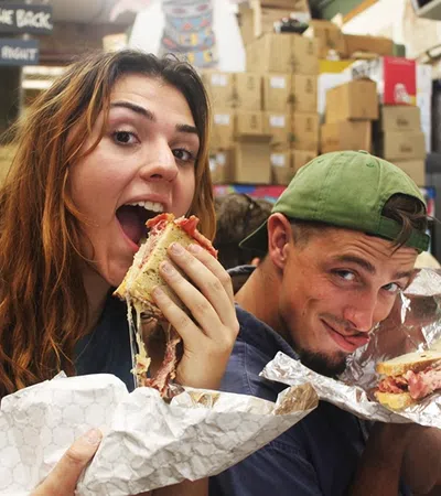 a man and woman eating food