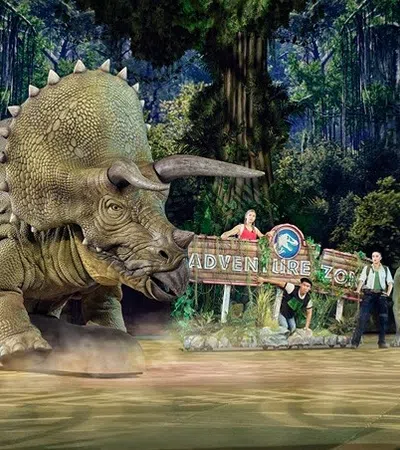 a group of people standing next to a statue of an elephant