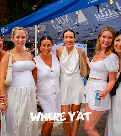 a group of women in white dresses