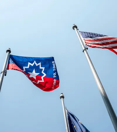 a group of flags on poles