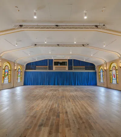 a large room with stained glass windows
