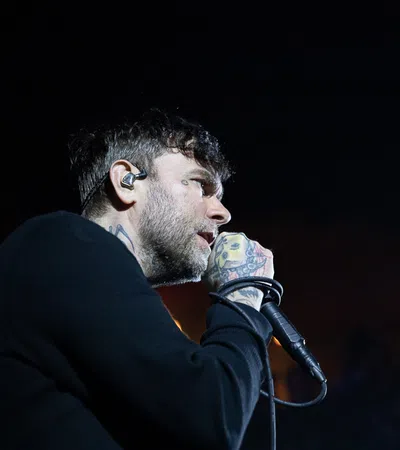 a man with a beard and a microphone