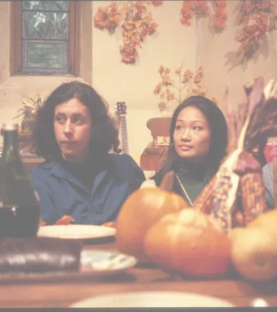 Tina Chen et al. sitting at a table with food
