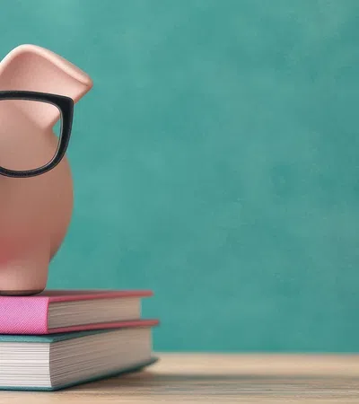 a piggy bank on a stack of books