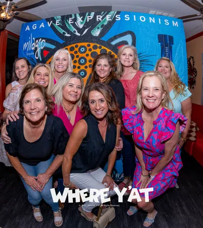a group of women posing for a photo